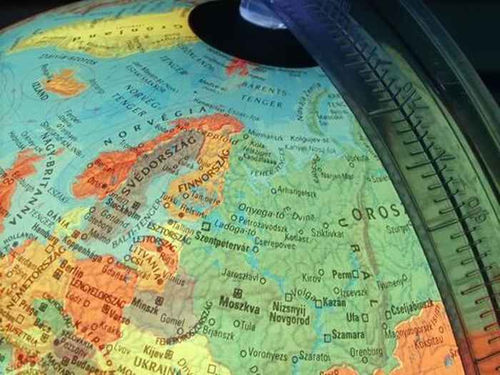 Close-up photo of a section of a colourful globe, focusedt on Europe.